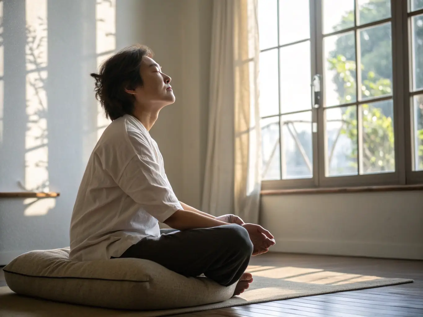 A visually appealing image of a person meditating with a peaceful expression, surrounded by soft, warm light, symbolizing emotional well-being.